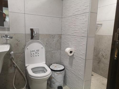 a small bathroom with a toilet and a sink at Bab Al Shams Resort in Jericho