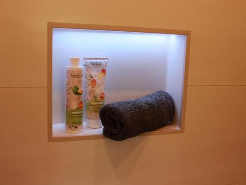 a towel dispenser on a wall in a bathroom at Ferienhaus Gerda in Wangerland