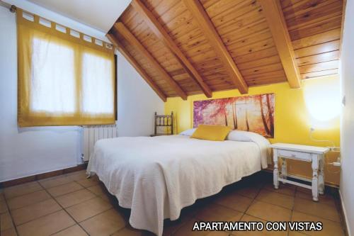 Ліжко або ліжка в номері Apartamentos Taüll