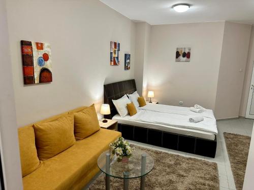 a living room with a couch and a bed at Guest House FAMILY in Plovdiv