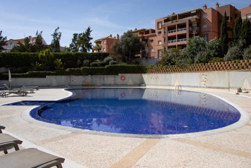 a swimming pool in the middle of a patio at ApartPatos Luxury Home in Portimão