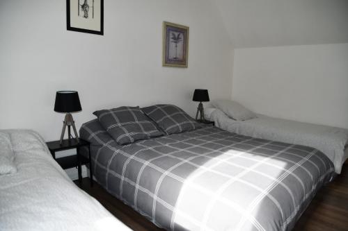 Postel nebo postele na pokoji v ubytování Maison Marguerite