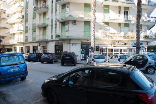 a car parked in a parking lot in front of a building at CAPRI B&B in Salerno