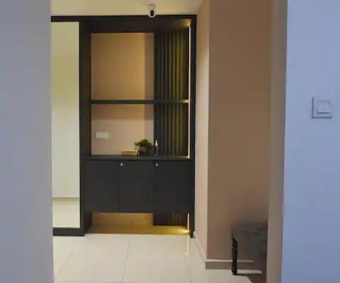 a black door with a mirror in a room at Legasi Kampung baru guest house by rumahrehat 1908sqft huge balcony for BBQ twin tower view in Kuala Lumpur