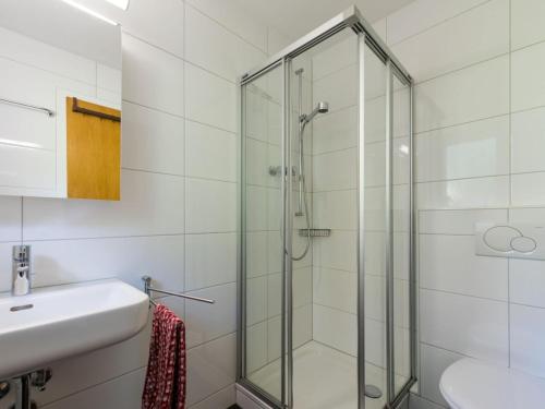 a bathroom with a glass shower and a sink at Beautiful holiday home in Fieschertal with garden in Fieschertal