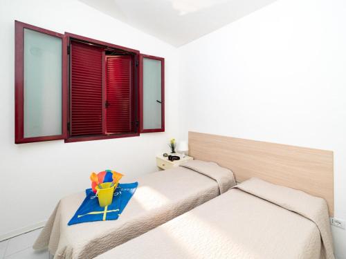 a bedroom with two beds with a tray on it at Inviting holiday home in Altidona with solarium in Pedaso