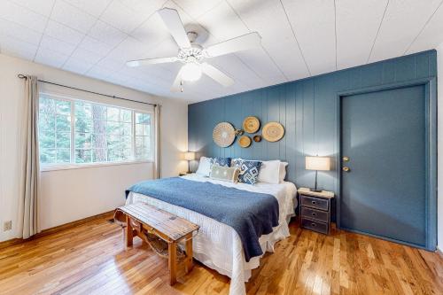 a bedroom with a bed and a ceiling fan at Riverbend in Joseph