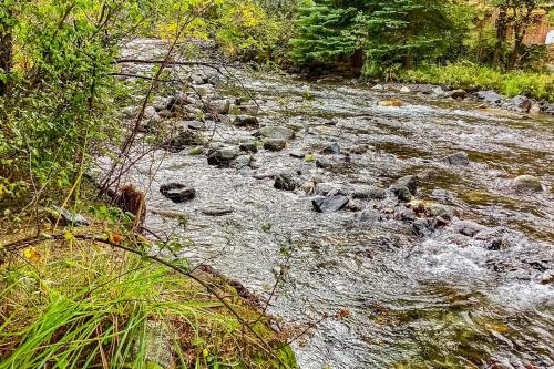 a stream of water with rocks in a river at Riverbend in Joseph