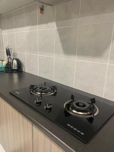 Η κουζίνα ή μικρή κουζίνα στο D'Rinie Sky Homestay