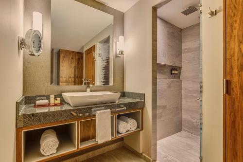 a bathroom with a sink and a shower at Fiesta Americana Viaducto Aeropuerto in Mexico City