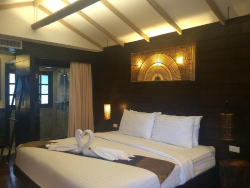 Postel nebo postele na pokoji v ubytování Sea Garden Resort Haad Chao Phao