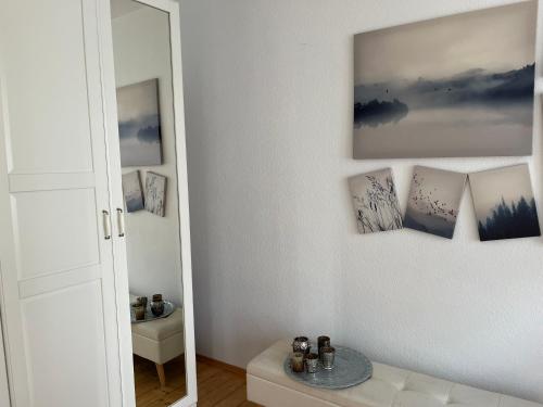 a bathroom with a mirror next to a mirror at Stilvolle Altstadtwohnung mit 2 Schlafzimmern in Koblenz
