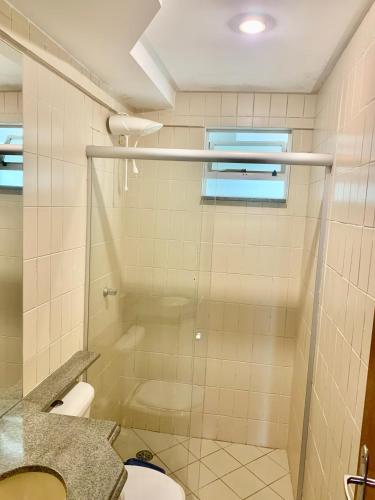 a bathroom with a shower and a toilet at Apartamento 3 quartos Bueno com 2 garagens in Goiânia