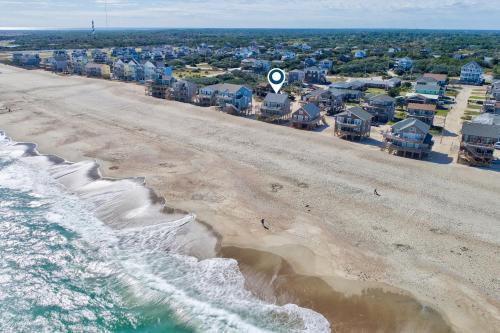 an aerial view of a beach with houses and condos at Harper House #4BB in Buxton