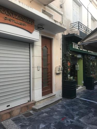 a store front of a building with a door at Plateia sea view loft in Samos