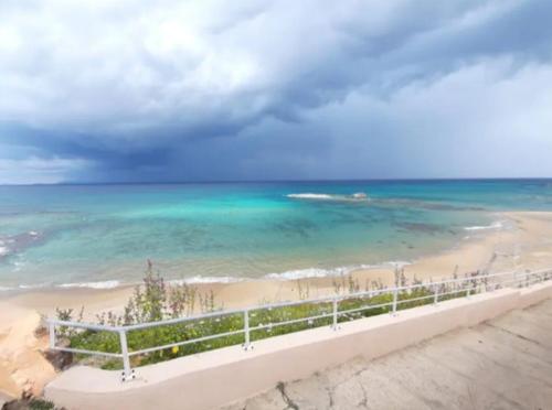 a view of the beach and the ocean at Casa Angheledda in Nulvi