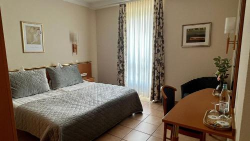Postel nebo postele na pokoji v ubytování Hotel Victoria