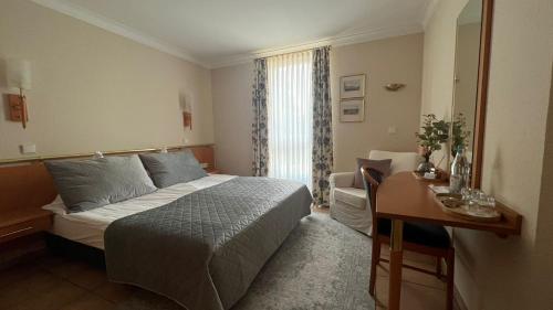 Postel nebo postele na pokoji v ubytování Hotel Victoria