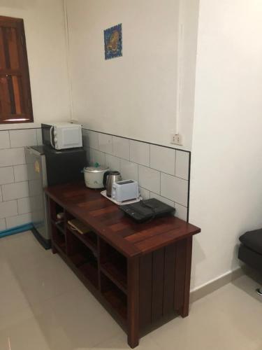 a kitchen with a table with two microwaves on it at Number SIX house for up to 5 guests with 2 bedrooms in Ko Samed