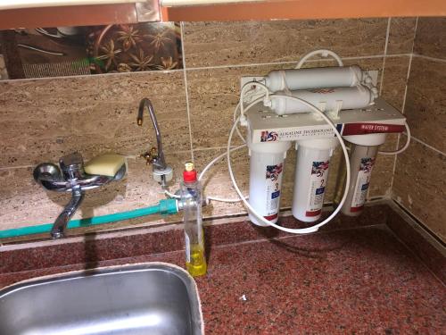 a kitchen counter with a mixer and a sink at AC, Wi-Fi Panorama View Shahrazad Beach Apartment in Alexandria