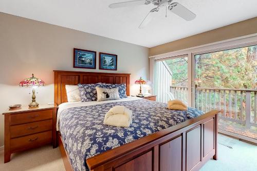 a bedroom with a bed and a large window at Great Lakes 49 50 in Glen Arbor