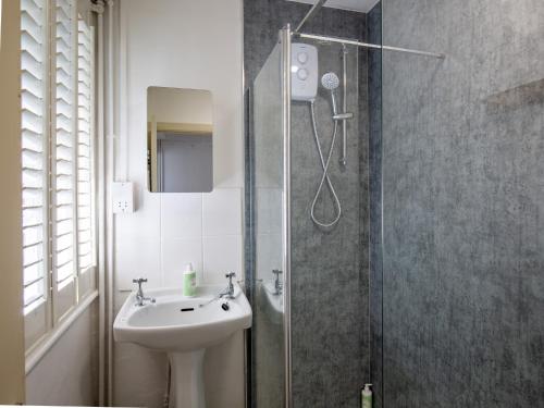 a bathroom with a sink and a shower at Arrow Lodge at Ragley Estate in Weethley