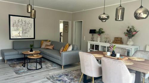 a living room with a couch and a table at Hotel Victoria in Dinslaken