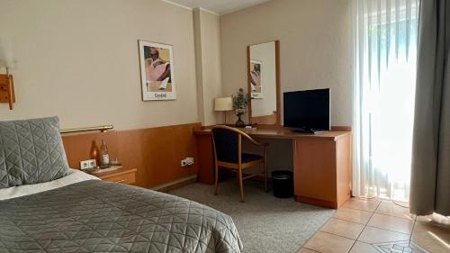 Postel nebo postele na pokoji v ubytování Hotel Victoria