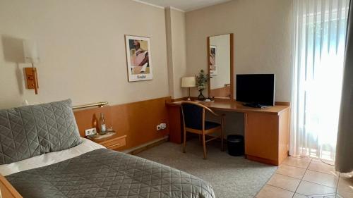 TV a/nebo společenská místnost v ubytování Hotel Victoria