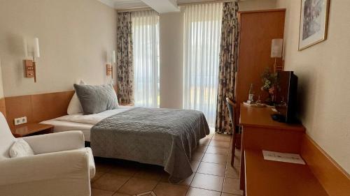 Postel nebo postele na pokoji v ubytování Hotel Victoria