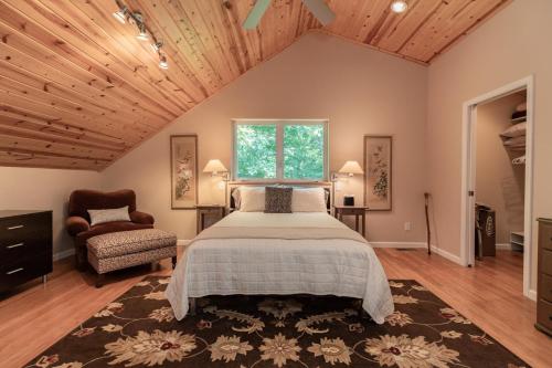 a bedroom with a large bed and a window at Moonlight Ridge - Powder Horn Mountain in Powderhorn Mountain