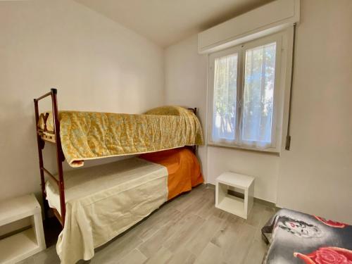 A bed or beds in a room at Appartamento Etruria