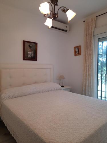 Кровать или кровати в номере Adosado en campo de golf Islantilla