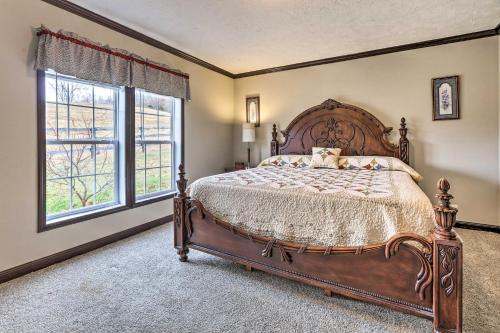 a bedroom with a large bed and a window at Lovely Sadieville Retreat with Deck and Grill! in Corinth