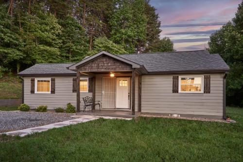 a tiny house with a garage in a yard at Private Peaceful House near Lake Lure Chimney Rock in Rutherfordton