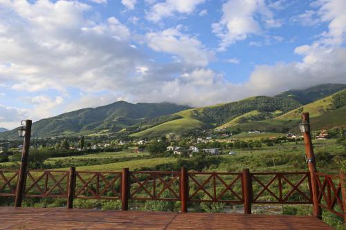 a view of a valley with mountains in the background at Posada La Guadalupe in Tafí del Valle