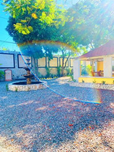 a fountain in the middle of a yard at Villa Marcia in Boca Chica