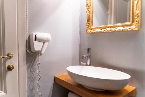 a bathroom with a white sink and a mirror at Art Hotel Villa Agape - Place of Charme in Florence