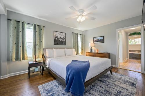 a bedroom with a bed and a ceiling fan at Plan A Trip To Georgia Aquarium In This Comfy 3BR in Atlanta