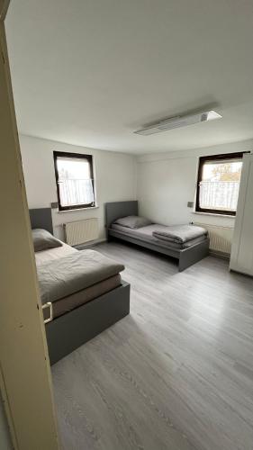 Postel nebo postele na pokoji v ubytování Monteurzimmer Ringingen