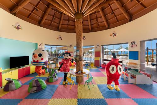 a childrens play room with toys in it at Mövenpick Resort & Spa Tala Bay Aqaba in Aqaba