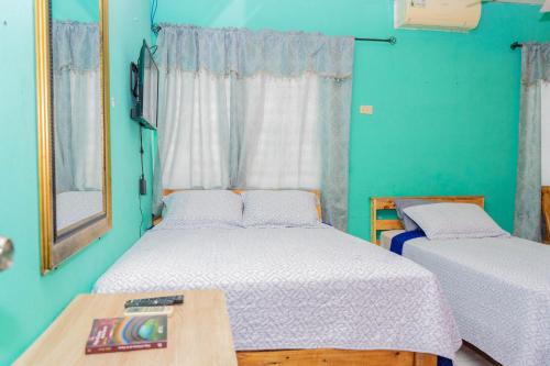 Cama o camas de una habitación en Hostal Familiar Argeñal