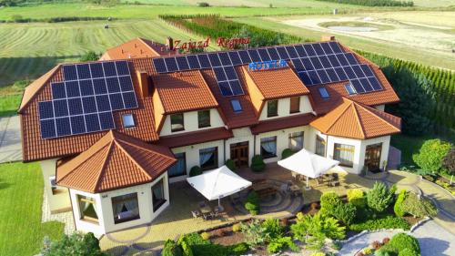 a house with solar panels on its roof at Hotel Regina in Radom