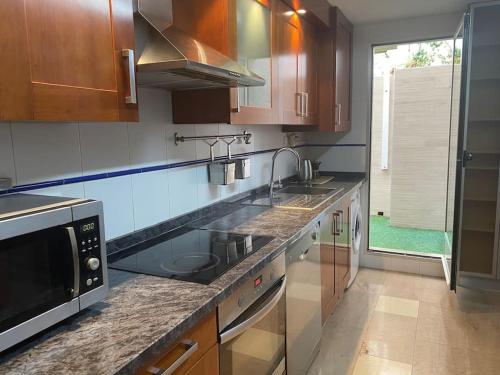 Kuchyň nebo kuchyňský kout v ubytování Bonito Apartamento con wifi y patio