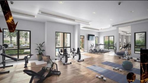 a gym with several treadmills and machines in a room at Madinat Jumeirah Living One bedroom apartment in Dubai
