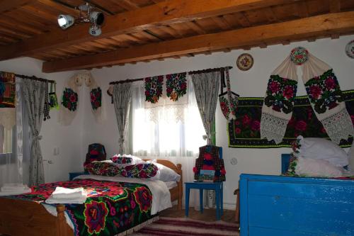 a bedroom with a bed and christmas decorations on the walls at La Rodica in Vale in Ocna Şugatag