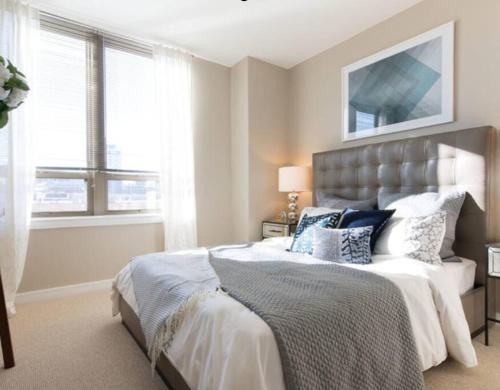 a bedroom with a large bed and a window at National at Pentagon in Arlington