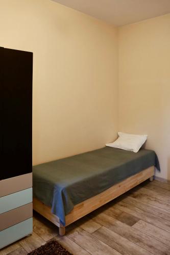 a bedroom with a bed and a flat screen tv at Apartamenty Wilga spokojne miejsce z całorocznym jacuzzi i letnim basenem in Wilga
