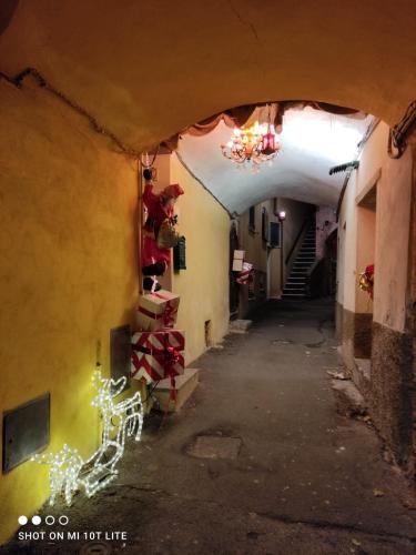 an alley way with a staircase in a building at Casa Vacanze Family in Albisola Superiore