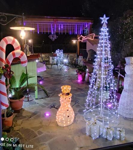 a christmas display in a yard with a christmas tree at Casa Vacanze Family in Albisola Superiore